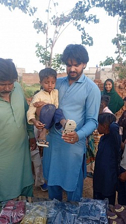 Giving shoes to the children
